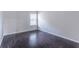 Empty bedroom with dark hardwood floors at 2162 Reddy Farm Lane, Grayson, GA 30017