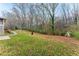 Large backyard with a shed and wooded area at 240 Thornton Dr, Fayetteville, GA 30214