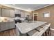 Modern kitchen with gray cabinets, granite counters, and island at 4878 Golden Finch Ln, Powder Springs, GA 30127