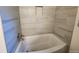 Modern bathroom with updated bathtub and tile surround at 3349 Glenview Sw Cir, Atlanta, GA 30331