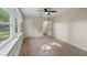 Bright bedroom with carpet, built-in shelves, and ceiling fan at 3459 Maplehurst Dr, Decatur, GA 30032