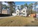 Two-story house with attached garage and manicured lawn at 6495 Bennington Dr, Tucker, GA 30084