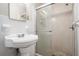 Clean bathroom with pedestal sink, shower, and updated fixtures at 2170 Golden Dawn Sw Dr, Atlanta, GA 30311