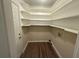 Laundry area with built-in shelving and vinyl flooring at 2170 Golden Dawn Sw Dr, Atlanta, GA 30311