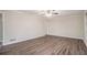 Bright living room with hardwood floors and ceiling fan at 2170 Golden Dawn Sw Dr, Atlanta, GA 30311