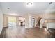 Open living room and kitchen with hardwood floors and access to deck at 5426 Radford Ln, Lithonia, GA 30038