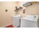 Convenient laundry room with washer, dryer, and ample shelving at 2249 Ewell Park Dr, Lawrenceville, GA 30043