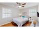 Well-lit bedroom with a queen-size bed and hardwood floors at 3033 Empire Sw Blvd, Atlanta, GA 30354