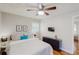 Bright bedroom with a queen bed and hardwood floors at 3033 Empire Sw Blvd, Atlanta, GA 30354