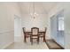 Bright dining room with chandelier and sliding glass doors to patio at 976 Martin Heights Dr, Lawrenceville, GA 30044