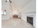 Open living space with a fireplace and dining area, featuring tile flooring at 976 Martin Heights Dr, Lawrenceville, GA 30044