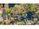 Aerial view of a house and surrounding woods at 157 Reynolds Rd, Bowdon, GA 30108
