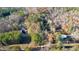 Aerial view showing a property's location in a wooded area at 157 Reynolds Rd, Bowdon, GA 30108