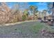 Spacious backyard with wooded area and shed at 157 Reynolds Rd, Bowdon, GA 30108