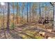 Backyard with wooded area and wooden deck at 157 Reynolds Rd, Bowdon, GA 30108