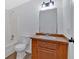 Simple bathroom with a tub, toilet and wood vanity at 157 Reynolds Rd, Bowdon, GA 30108