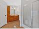 Inviting bathroom with double vanity, wood cabinets and walk-in shower at 157 Reynolds Rd, Bowdon, GA 30108