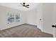 Bright bedroom with double windows and ceiling fan at 157 Reynolds Rd, Bowdon, GA 30108