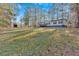 Single-story home with deck, large yard, and wooded lot at 157 Reynolds Rd, Bowdon, GA 30108