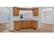 Kitchen with wood cabinets and breakfast bar at 157 Reynolds Rd, Bowdon, GA 30108