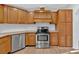 Kitchen with stainless steel appliances and wood cabinets at 157 Reynolds Rd, Bowdon, GA 30108