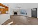 Spacious living room featuring a fireplace and large window at 157 Reynolds Rd, Bowdon, GA 30108