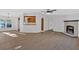 Open concept living room with kitchen views and fireplace at 157 Reynolds Rd, Bowdon, GA 30108