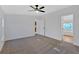 Main bedroom featuring ceiling fan and en-suite bathroom at 157 Reynolds Rd, Bowdon, GA 30108