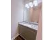 Modern bathroom with granite countertop and gray cabinets at 2005 Ocean Nw Dr, Atlanta, GA 30318