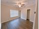 Spacious bedroom with dark wood-look floors and large window at 2005 Ocean Nw Dr, Atlanta, GA 30318