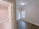 Bedroom with dark wood-look floors and an ensuite bathroom at 2005 Ocean Nw Dr, Atlanta, GA 30318