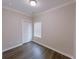 Bedroom with dark wood-look floors and closet at 2005 Ocean Nw Dr, Atlanta, GA 30318