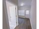 Spacious bedroom with wood floors and exterior access at 2005 Ocean Nw Dr, Atlanta, GA 30318