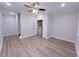 Spacious bonus room with wood-look flooring and ceiling fan at 2005 Ocean Nw Dr, Atlanta, GA 30318