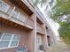 Rear exterior view of brick building with private decks at 2005 Ocean Nw Dr, Atlanta, GA 30318