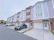 Modern townhouses with attached garages and ample parking at 2005 Ocean Nw Dr, Atlanta, GA 30318