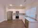 Modern kitchen with stainless steel appliances and granite counters at 2005 Ocean Nw Dr, Atlanta, GA 30318