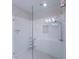Large walk-in shower with glass enclosure and hexagon tile floor at 2005 Ocean Nw Dr, Atlanta, GA 30318