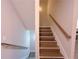Indoor staircase with wood-look flooring and neutral walls at 2005 Ocean Nw Dr, Atlanta, GA 30318