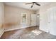 Large bedroom with carpet, window, and doors at 2108 Fairburn Sw Rd, Atlanta, GA 30331