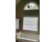 Bathroom featuring a bathtub, shower, and large window at 8228 River Pointe Overlook, Winston, GA 30187