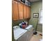 Laundry room with washer, dryer, and upper cabinets at 8228 River Pointe Overlook, Winston, GA 30187