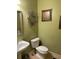 Small powder room with pedestal sink and toilet at 8228 River Pointe Overlook, Winston, GA 30187