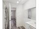 Bathroom with vanity, shower, and access to bedroom at 703 Pine Tree Trl, Atlanta, GA 30349