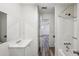 Bathroom with tub, vanity, and access to bedroom at 703 Pine Tree Trl, Atlanta, GA 30349