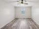 Spacious bedroom with wood-look floors and ceiling fan at 703 Pine Tree Trl, Atlanta, GA 30349