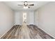 Bright bedroom featuring wood-look floors and ample closet space at 703 Pine Tree Trl, Atlanta, GA 30349
