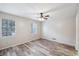 Spacious bedroom with hardwood floors and a ceiling fan at 703 Pine Tree Trl, Atlanta, GA 30349