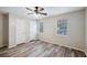Spacious bedroom with wood-look floors and ceiling fan at 703 Pine Tree Trl, Atlanta, GA 30349