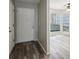 Bright entryway with hardwood floors and view into living room at 703 Pine Tree Trl, Atlanta, GA 30349